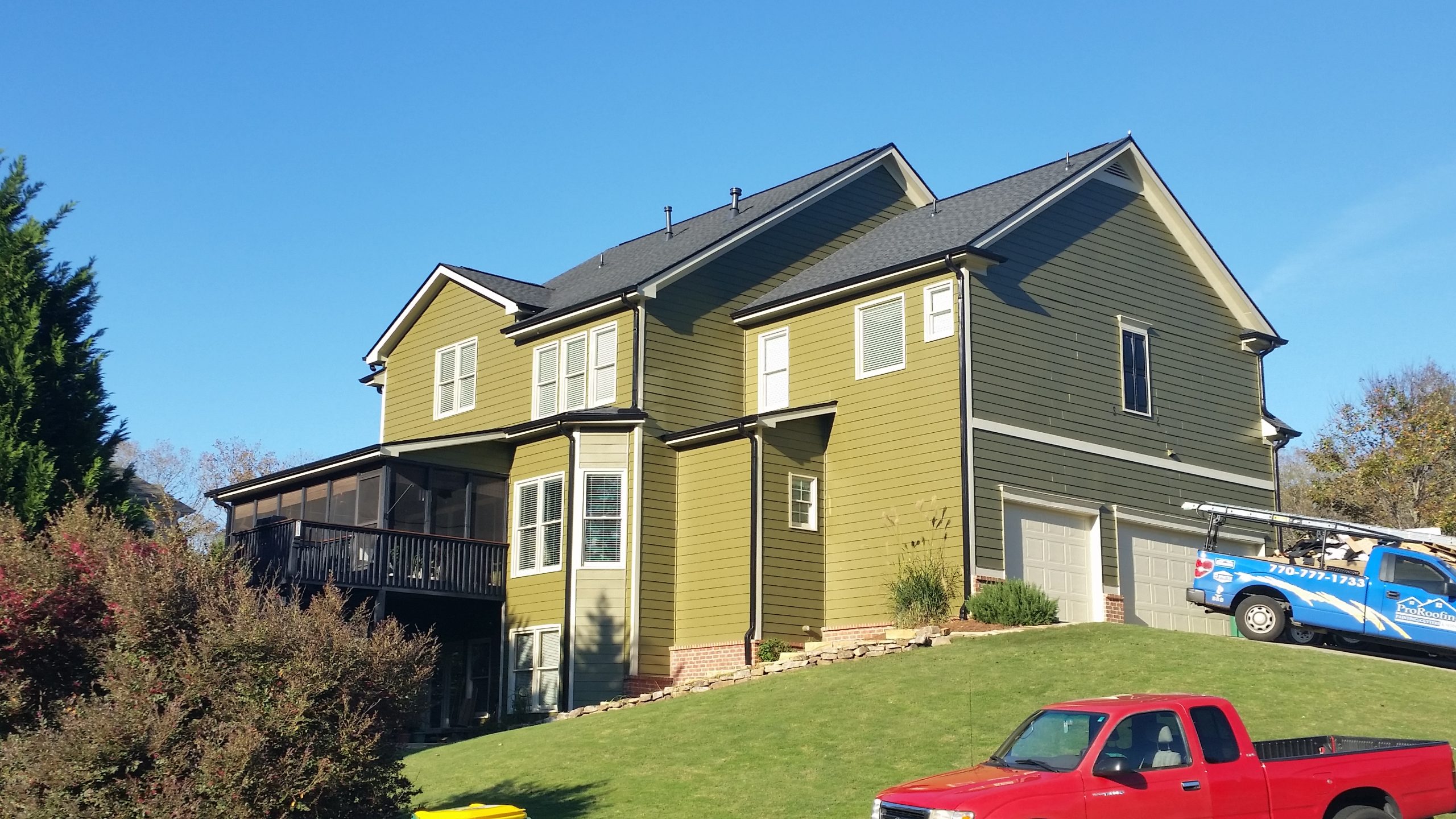 Siding 7 Siding installation in a light green color on a residential home