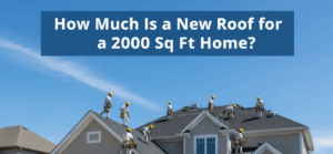 A large crew of roofers in yellow hard hats and safety gear are installing a new roof on a modern two-story house. Many workers are on the roof, while others are on the ground where stacks of new roofing materials are arranged on a blue tarp. A yellow dumpster and service van are parked in the driveway.